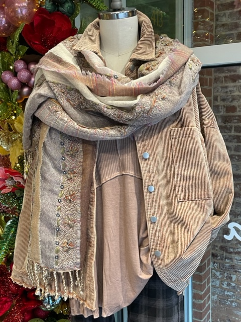 Light colored jacket with cottony blouse and scarf